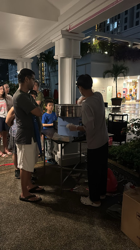 Evening event with families enjoying ice cream service