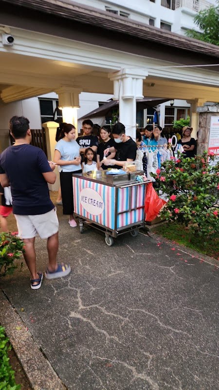 Colorful ice cream cart serving community event