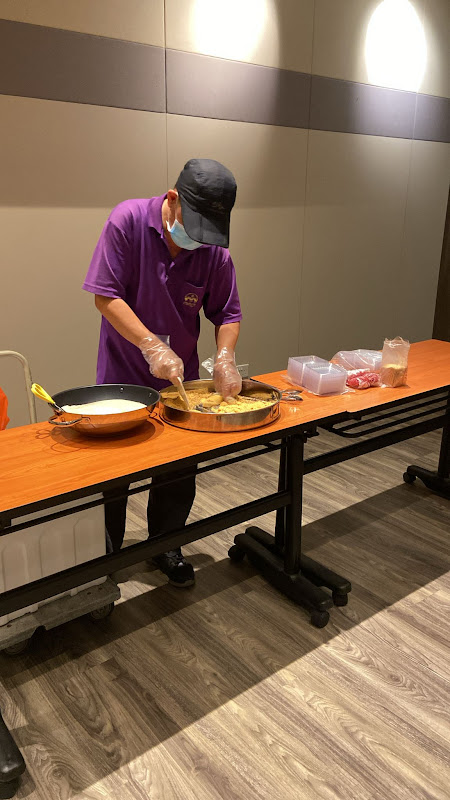 Professional chef preparing fresh food at corporate event